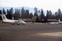 Grand Canyon National Park Airport (GCN) - Airside of terminal in 1988. America West N802AW on apron. - by Stan Howe