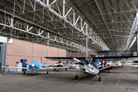 Perth Airport (Scotland) - General internal hangar view at Perth EGPT, highlighting the 1938 WWII roof construction, maximising on light. - by Clive Pattle