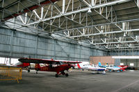 Perth Airport (Scotland), Perth, Scotland United Kingdom (EGPT) - General internal hangar view at Perth EGPT, highlighting the 1938 WWII roof construction, maximising on light. - by Clive Pattle