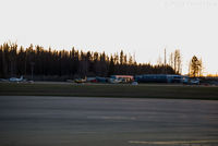 Prince George Airport - View of private aeroplanes parked in front of flying club offices. - by Remi Farvacque