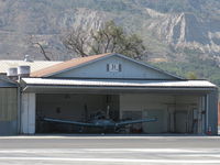 Santa Paula Airport (SZP) - Santa Paula Airport Do-It-Yourself Aircraft Paint Facility. Rare to see doors open, some masking of a Piper PA-28 is being done, and it is already hot mid-morning. - by Doug Robertson