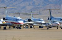 Kingman Airport (IGM) - Ramp with a few of the Embraers stored in IGM. - by FerryPNL