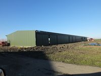 X3TB Airport - Tibenham Airfield Cladding almost finished of the new purpose built glider Hangar - will allow storage of gliders either side - full sliding doors on both sides. - by Keith Sowter
