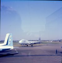 London Southend Airport, Southend-on-Sea, England United Kingdom (EGMC) - Southend Apron scene C.1976 with G-ASDC 'Plain Jane' and tail of Handley Page Herald  - by Paul Howlen
