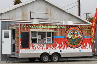 Santa Paula Airport (SZP) - Various food truck contractors are invited to feed the Aviation Museum crowds in addition to the open airport restaurant. This is a typical portable food truck setting up early on site. - by Doug Robertson