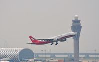 Shenzhen Bao'an International Airport - Shanghai A333 lifting of in front of Shenzhen Airport tower. - by FerryPNL