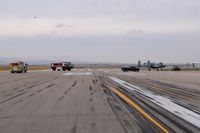 Boise Air Terminal/gowen Fld Airport (BOI) - Disabled A-10 being towed off runway followed by emergency equipment. - by Gerald Howard