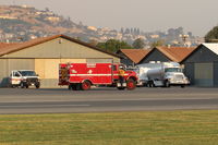 Santa Paula Airport (SZP) - CAL-FIRE contract support vehicle and fuel tankers in support of fighting the Thomas Fire-note smoky sky - by Doug Robertson