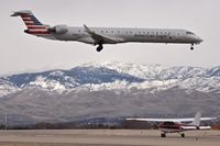 Boise Air Terminal/gowen Fld Airport (BOI) - American landing RWY 10R while the Cessna waits and the snows move closer. - by Gerald Howard