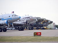 Duxford Airport, Cambridge, England United Kingdom (EGSU) - DC3s and an Li-2 lined up at Duxford before flying off to Caen, France on the 5th of June.  - by moxy